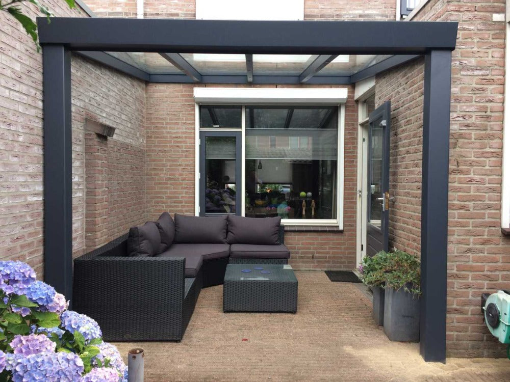 Deponti Giallo Aluminium Pergola Veranda Grey - Attched to a Brown House with Sofa Set